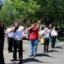 An honor guard takes part in a gun salute. 