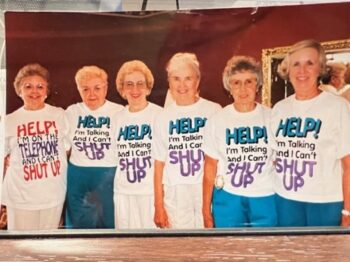 The Overall sisters wear T-shirts that state: "Help! I'm talking and I can't shut up!"