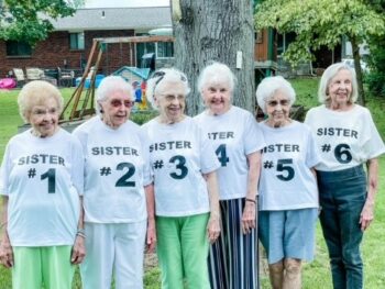 Six senior women wear shirts labeled "Sister #1" to "Sister #6."