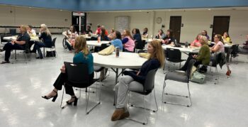 An auditorium has a wide variety of attendees. 