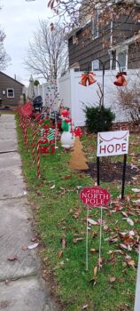 Christmas decorations line the walk in front of the Mullins apartment. 